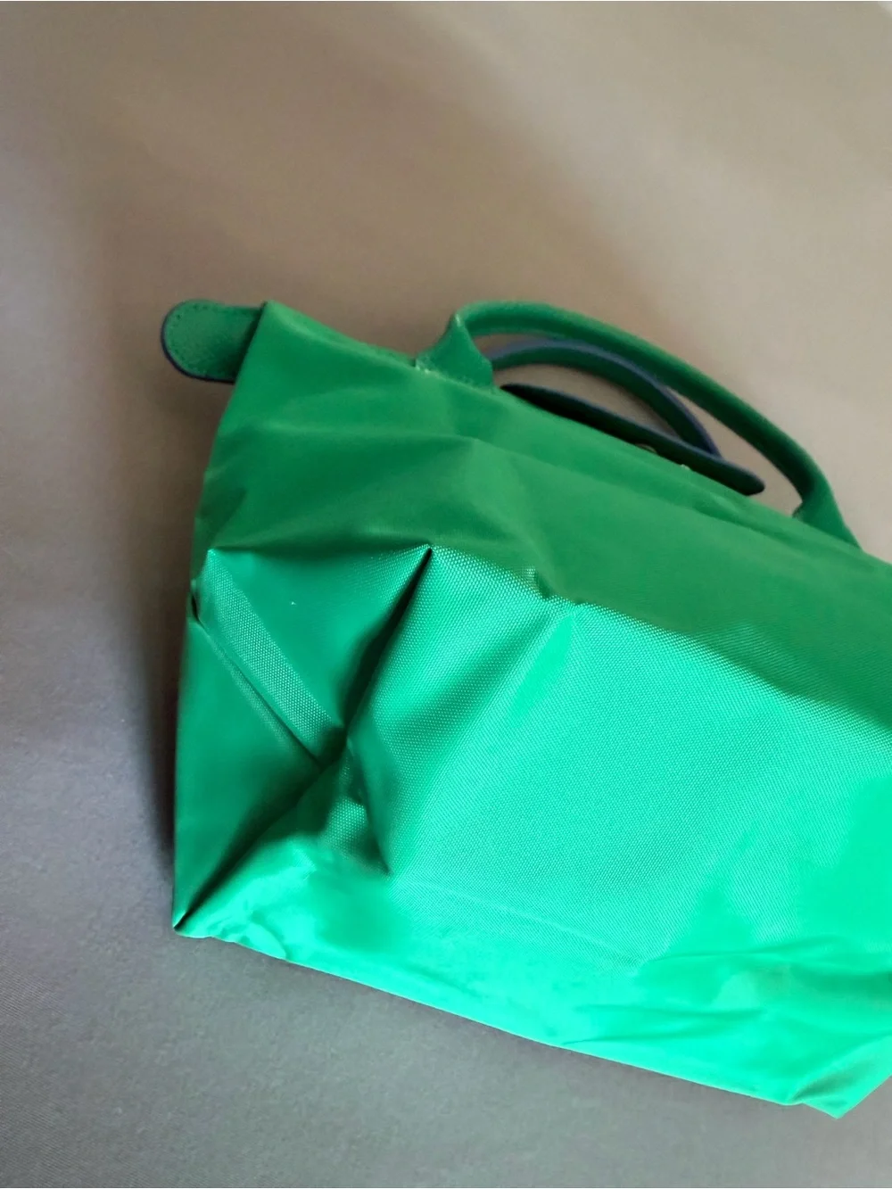 Longchamp green nylon top-handle tote with blue logo